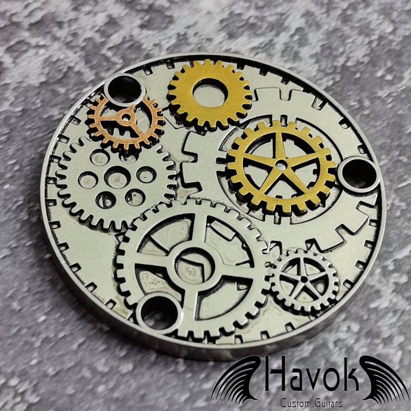 A vintage style metal neck plate for electric guitars with cogwheel design. The diameter is 54mm and the thickness is 3mm.