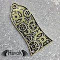 A vintage style metal truss rod plate for electric guitars. It comes in unique design of cogwheels. The color is brass.