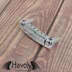 A silver Wilkinson wraparound bridge, for electric guitars like Gibson. The material is stainless steel.
